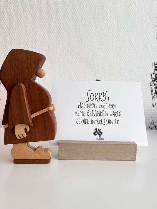 Weiße Postkarte von #heinzigartig mit dem Spruch: "Sorry, hab nicht zugehört, meine Gedanken waren gerade interessanter."